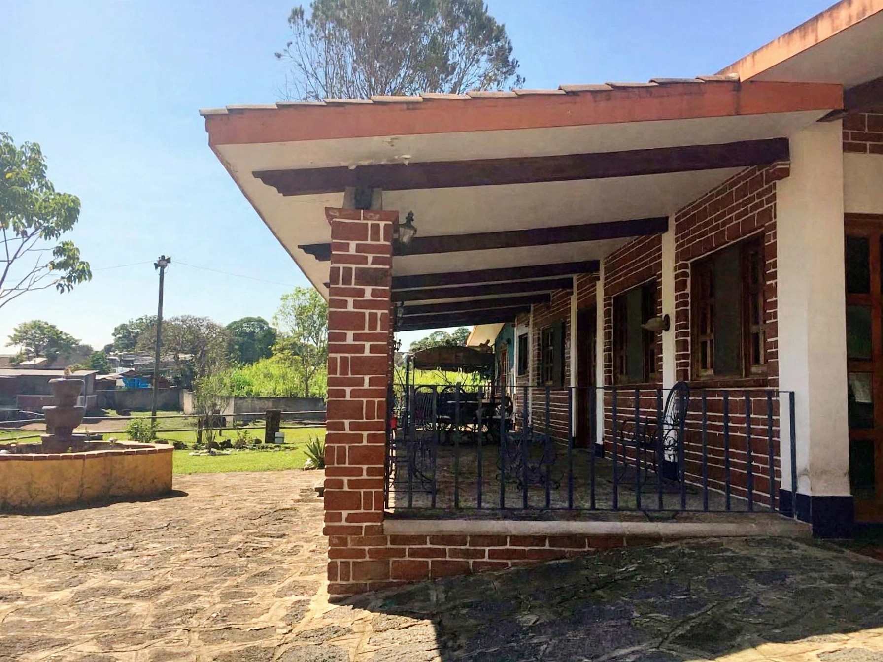 The wide covered porch of the main house